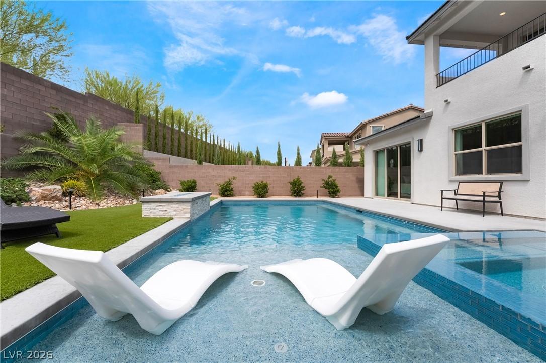Custom in-ground pool equipped with integrated swim jets at 127 Malpaso St