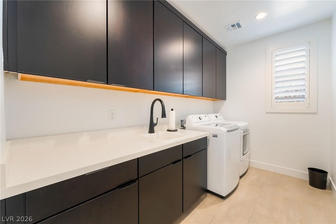 Dedicated laundry room with built-in storage and gas dryer connections