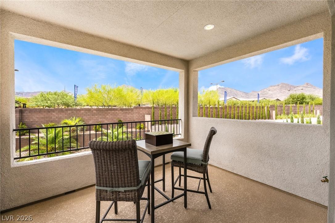 Spacious covered patio with integrated outdoor sound system in Acadia Ridge