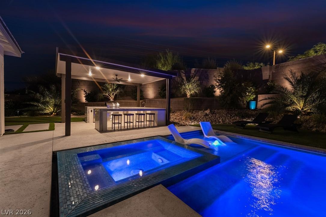 View of the private backyard and covered second-story viewing deck