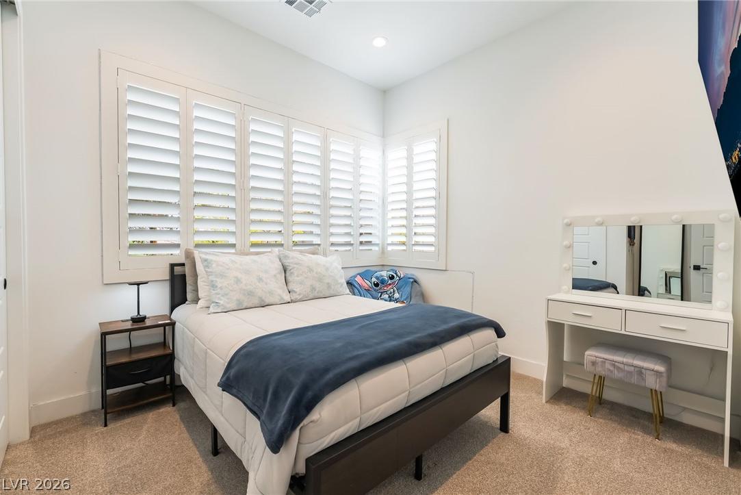 Spacious main-floor guest bedroom suite at 127 Malpaso in Summerlin West