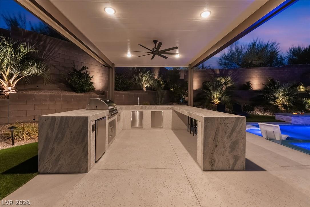 Covered outdoor kitchen and luxury entertainment pavilion at 127 Malpaso