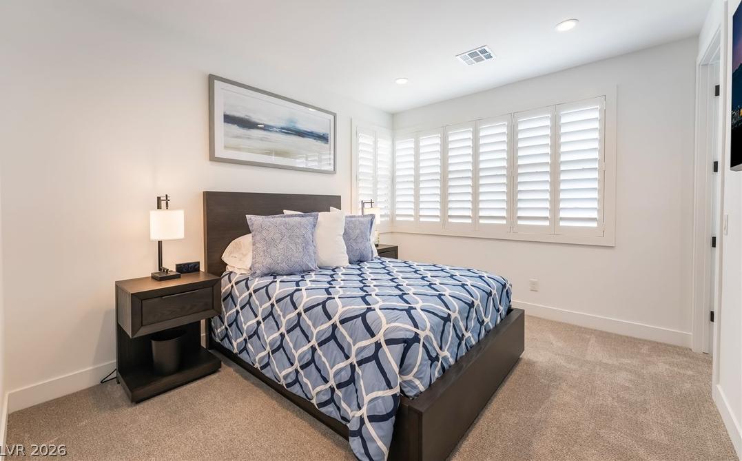 Well-appointed fourth bedroom with scenic window views in Las Vegas
