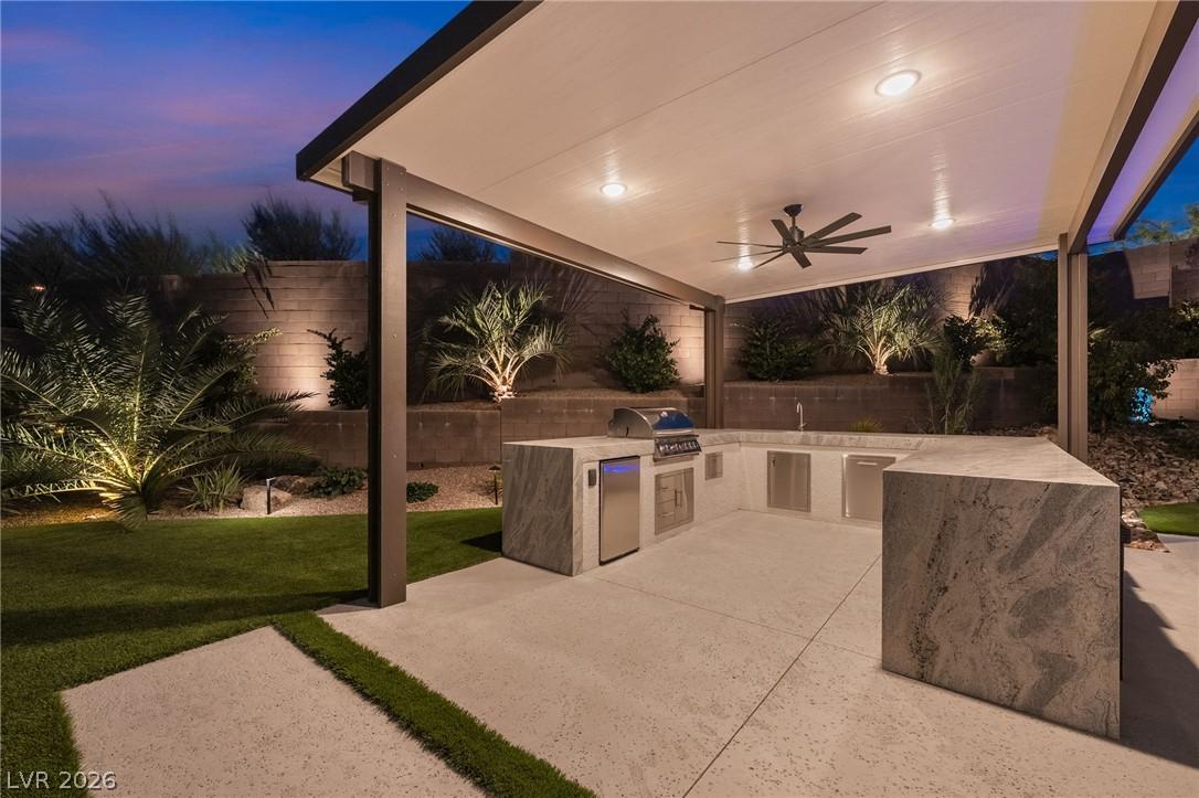 High-end stainless steel built-in barbecue grill in outdoor summer kitchen