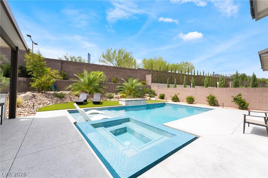 Relaxing poolside outdoor lounge area at 127 Malpaso in Las Vegas