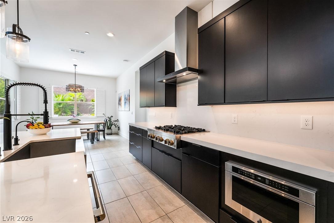 Luxury chef's kitchen with oversized waterfall island and built-in fridge at 127 Malpaso
